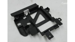 Bracket for fastening the electric motor for unlocking the movement me